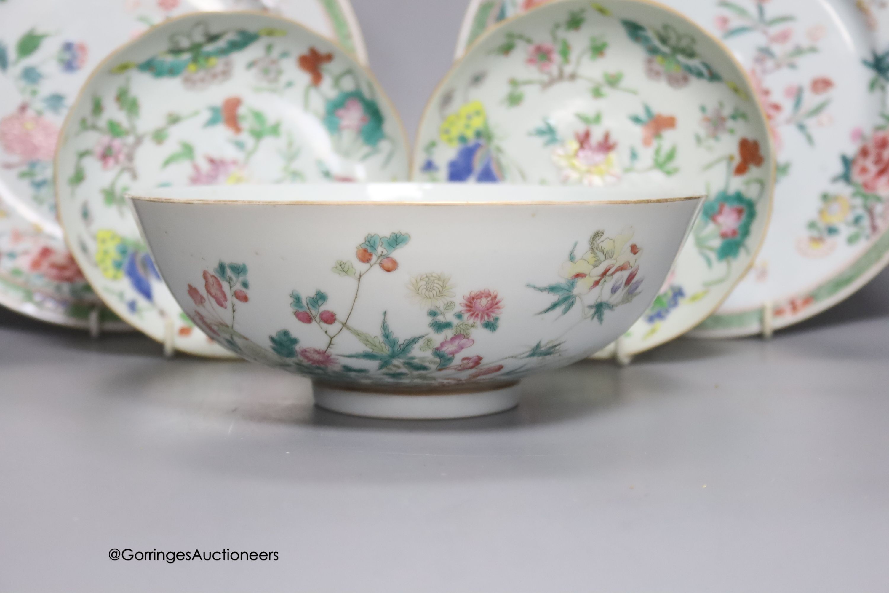 A 19th century Chinese famille rose bowl, two saucers and two 18th century Chinese famille rose plates 23cm